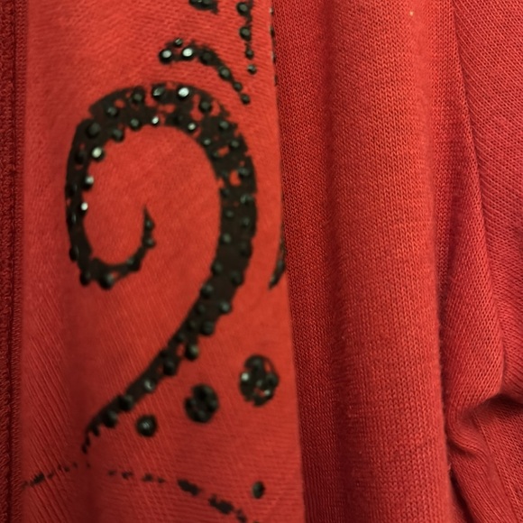 Red jacket with black detail. - Picture 3 of 5